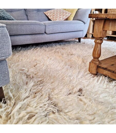 Tapis shaggy tissé main en laine FLOKATO Care&Fair